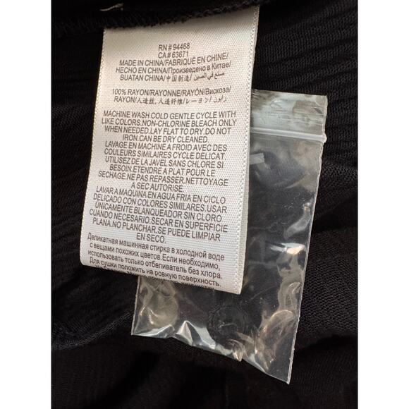 NWT BCBGENERATION Black Ruffle Sleeve Cut-Out Back One-Piece Romper Size 2 - Picture 7 of 7